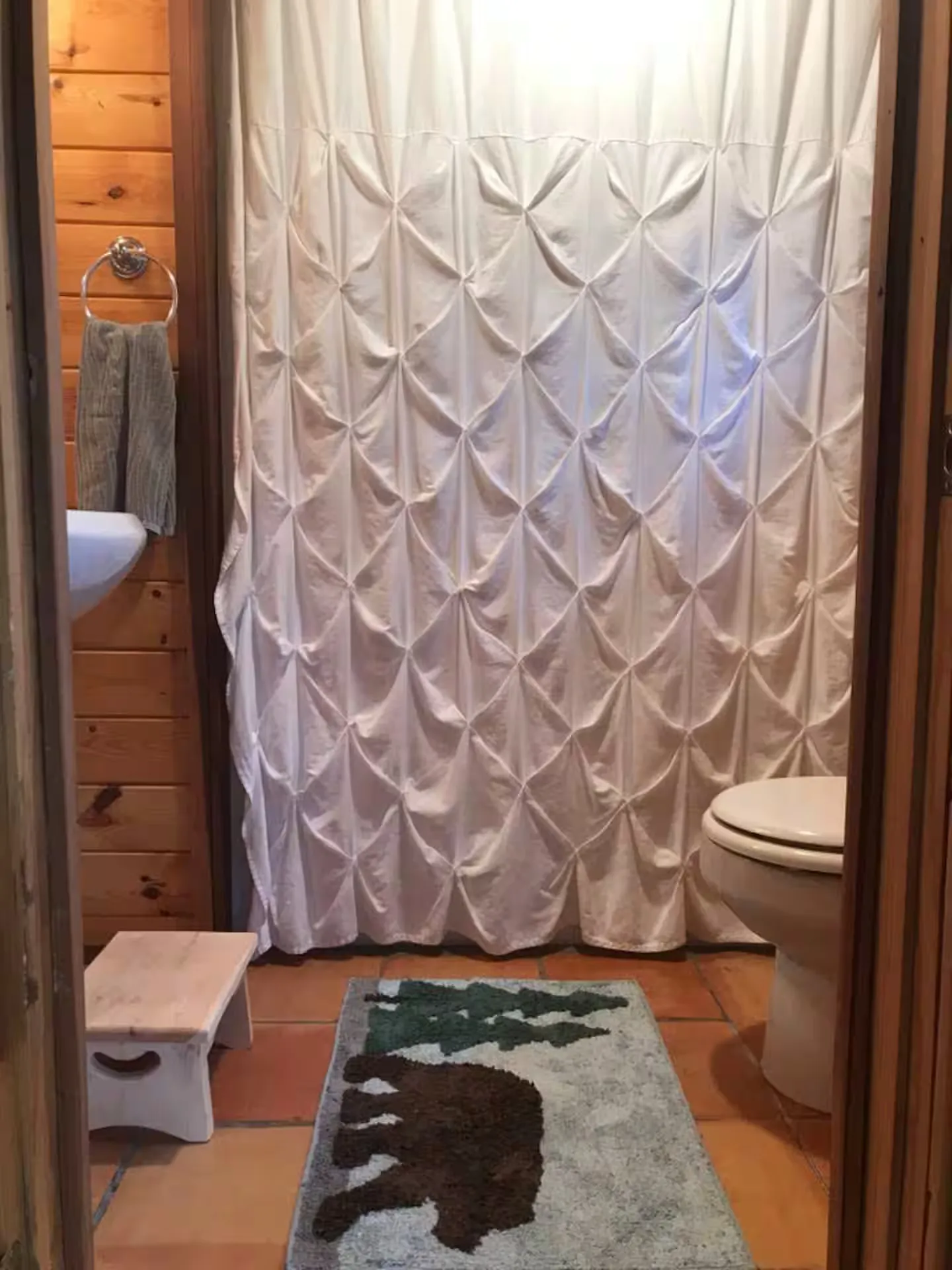 The main-level full bathroom.
