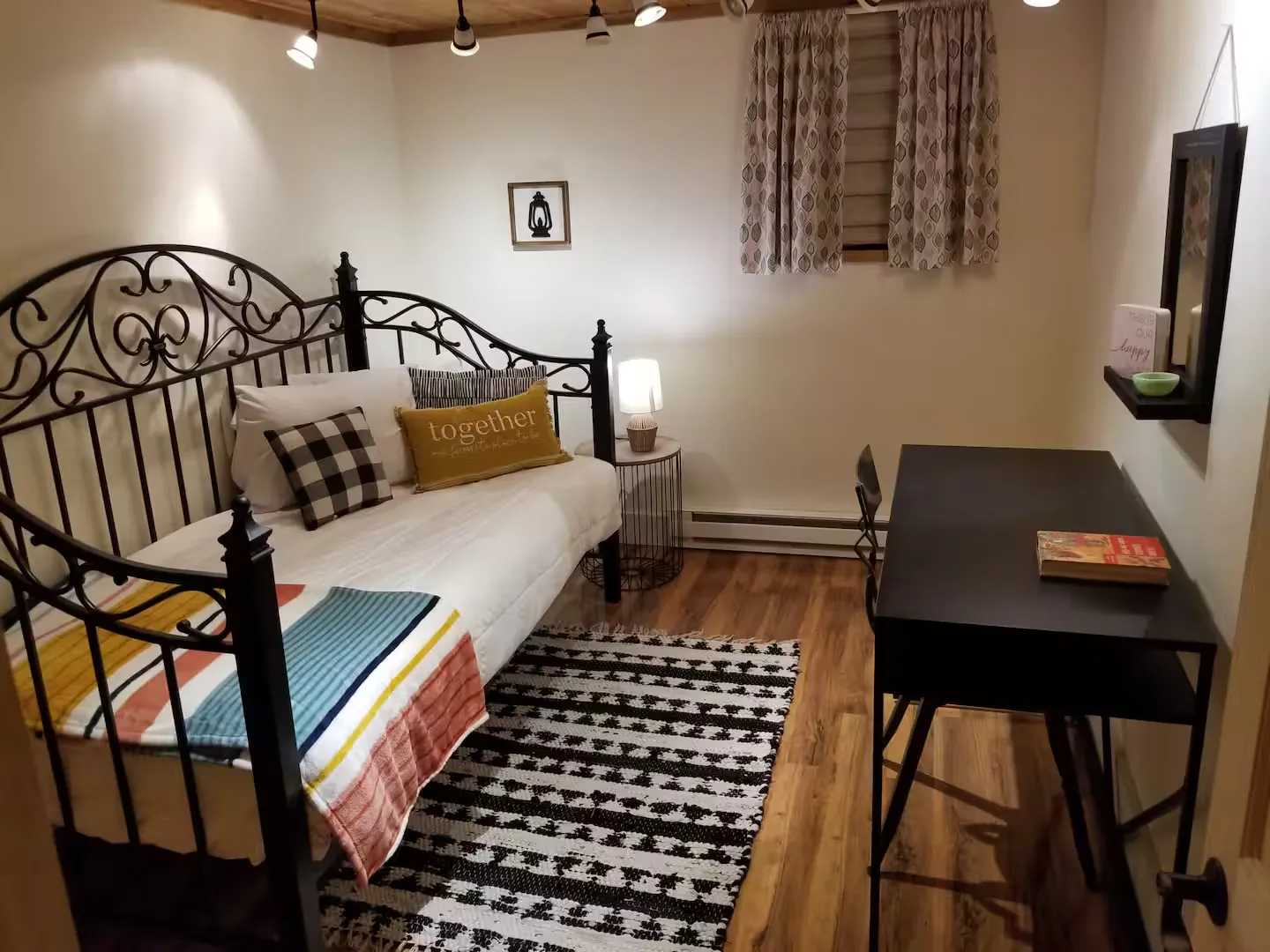 The main-level bedroom with daybed and trundle.