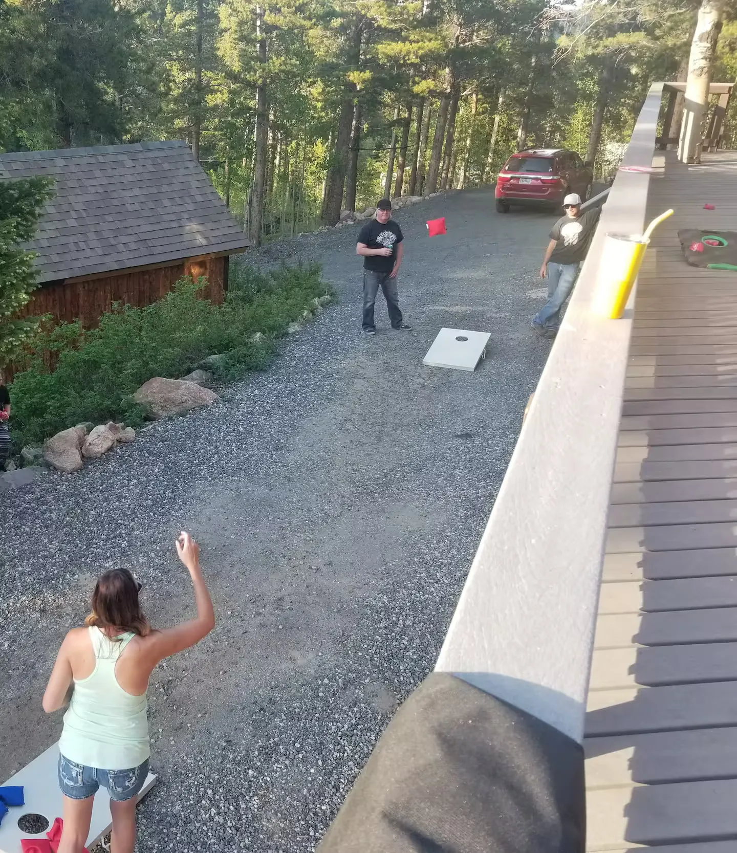 A cornhole game set up on the lawn.