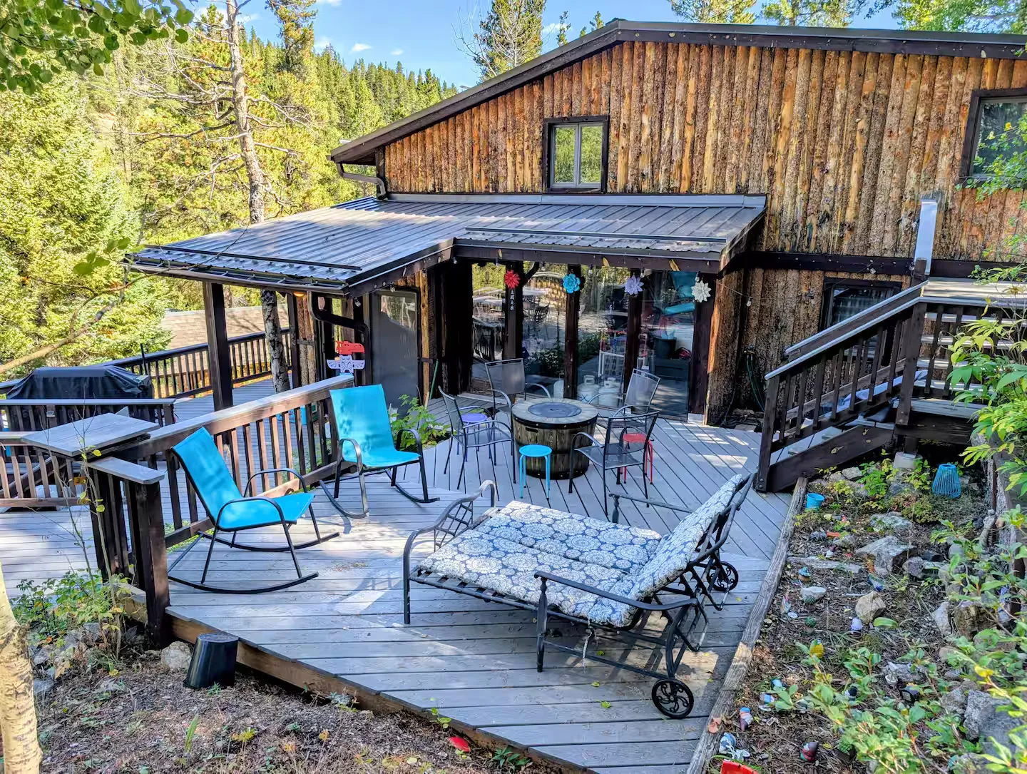 The wraparound deck looking out over the treetops at Rivendell Cabin.
