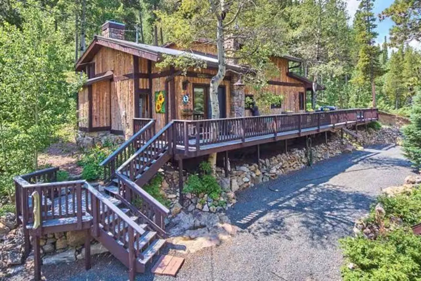 Aerial view of the back of the cabin and its wraparound deck.