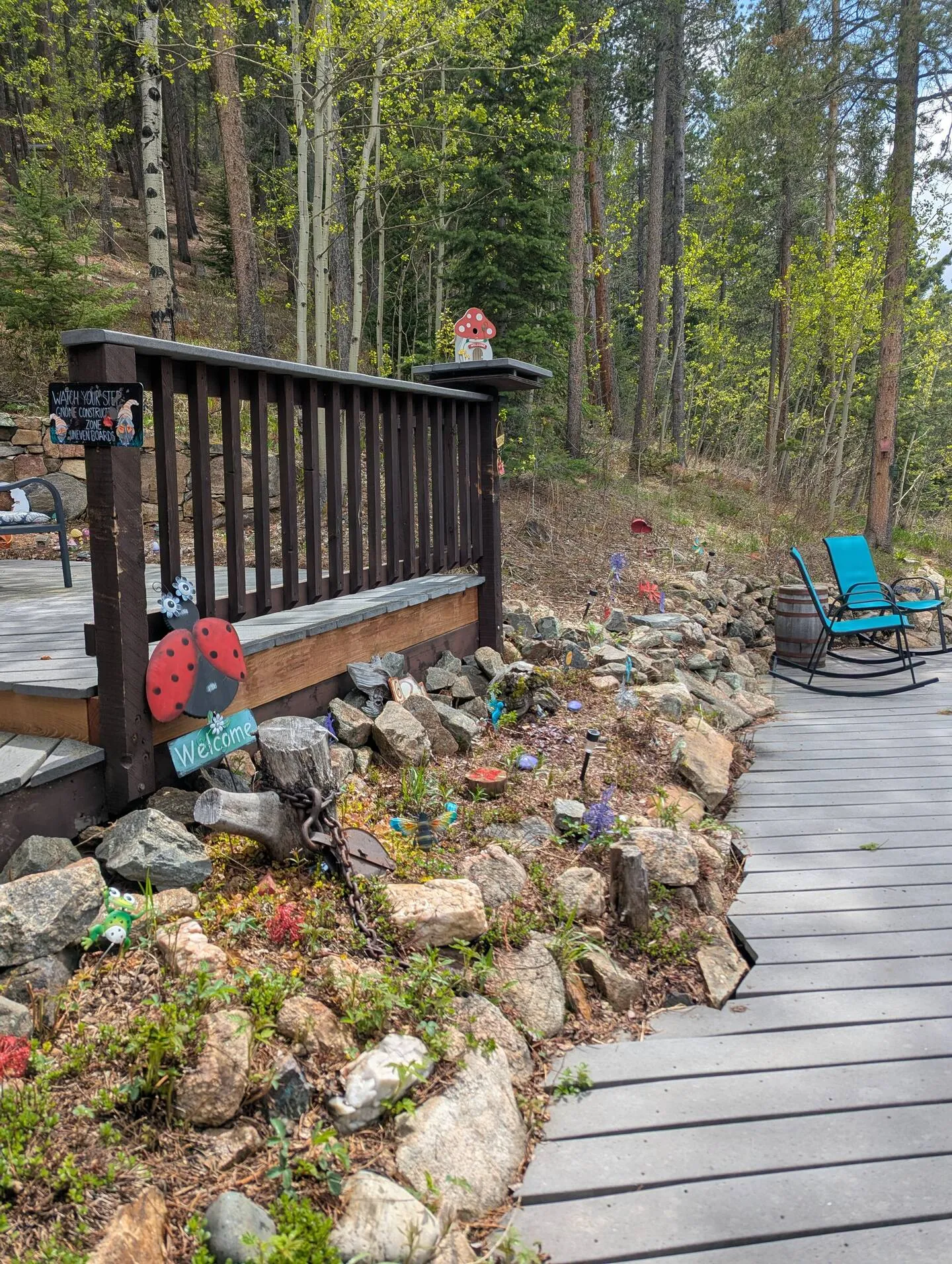 Whimsical fairy-garden charms tucked along the path.