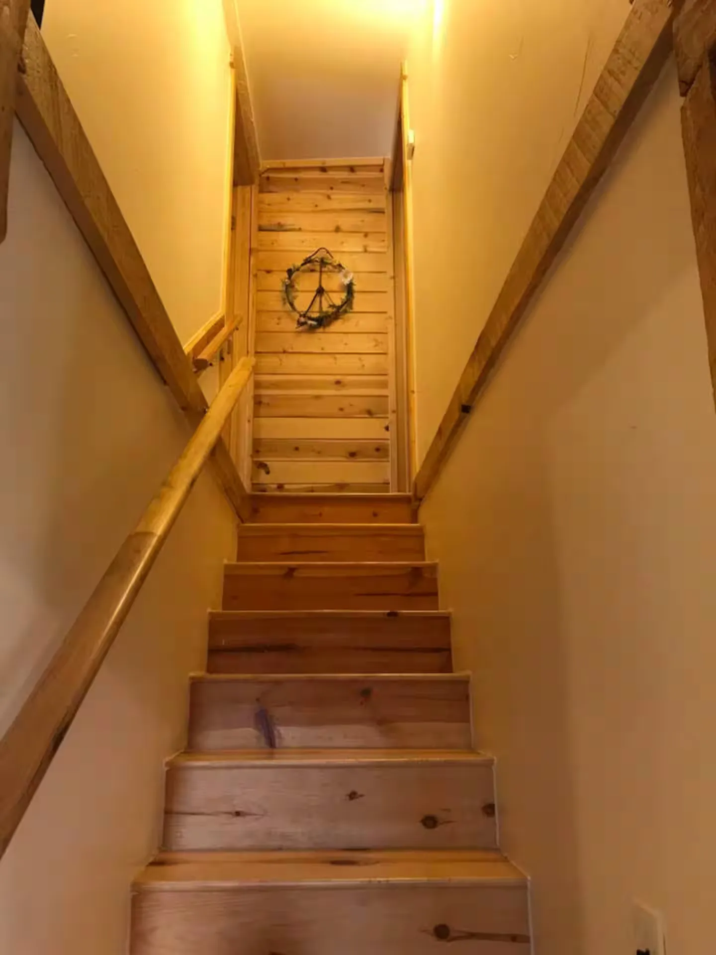 Stairs leading up to the bedrooms.
