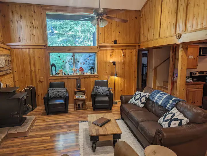 The living room's comfortable seating and natural light.