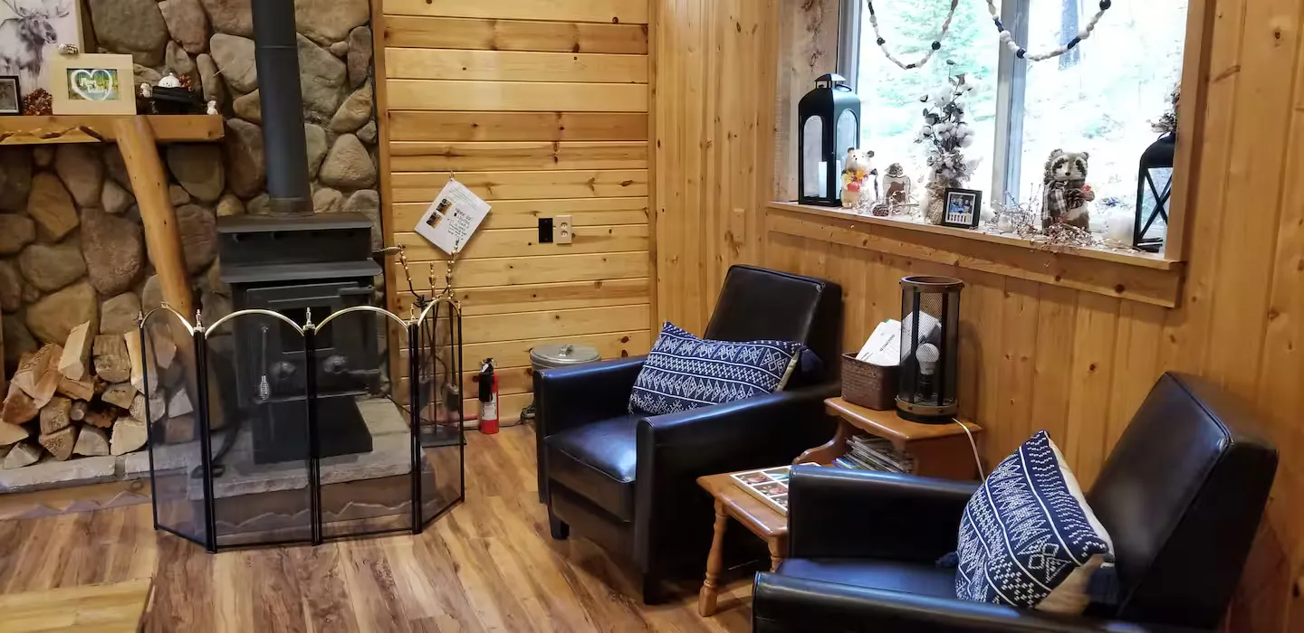 The wood-burning stove that warms the cabin.